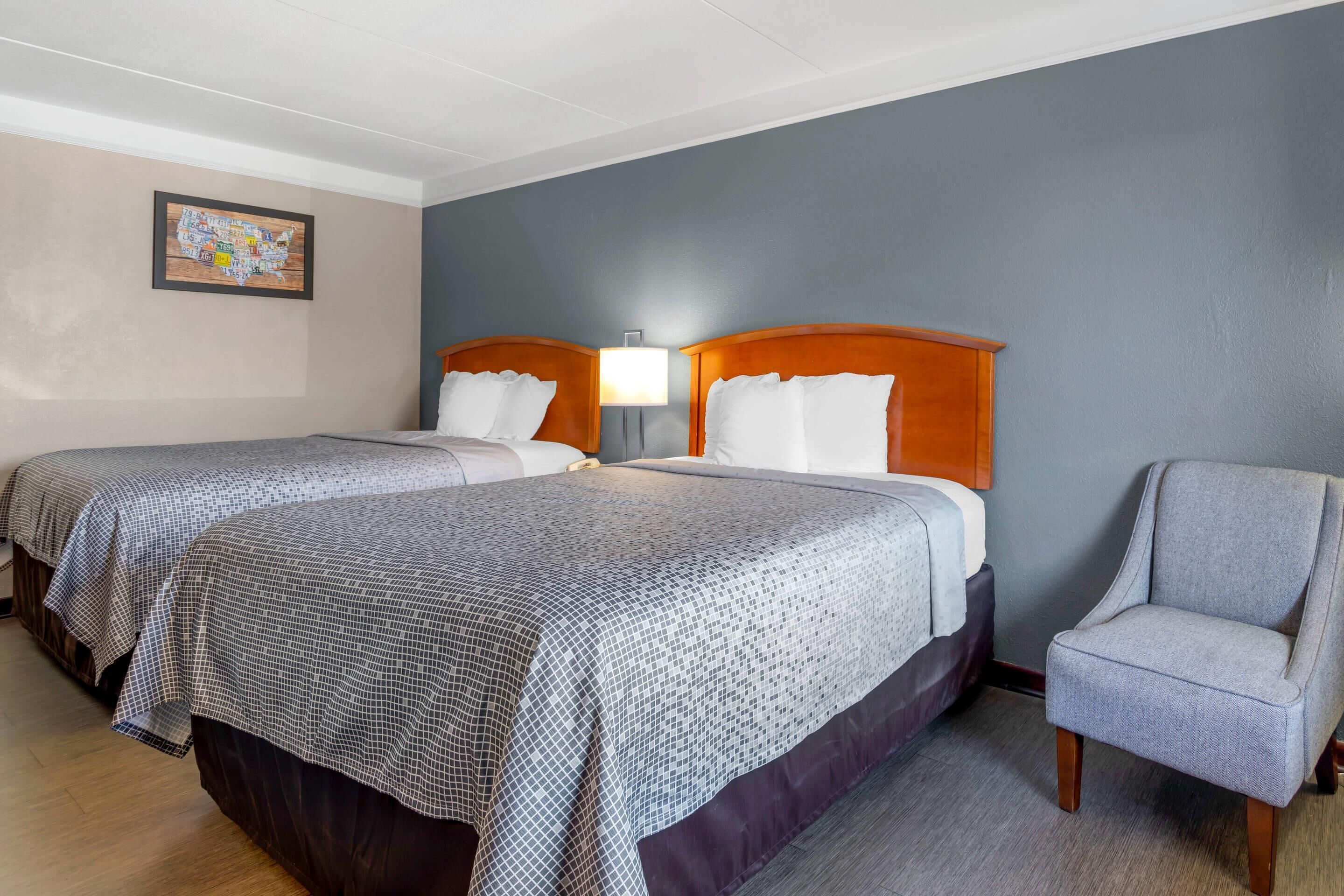 Room, 2 Queen Beds, Smoking | In-room safe, iron/ironing board, free WiFi, bed sheets