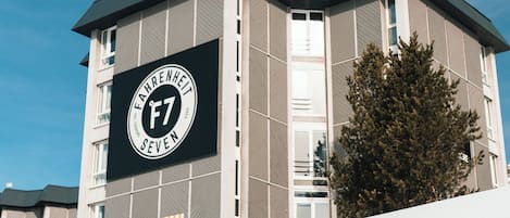 A modern building with a prominent sign reading 'FAHRENHEIT SEVEN.'