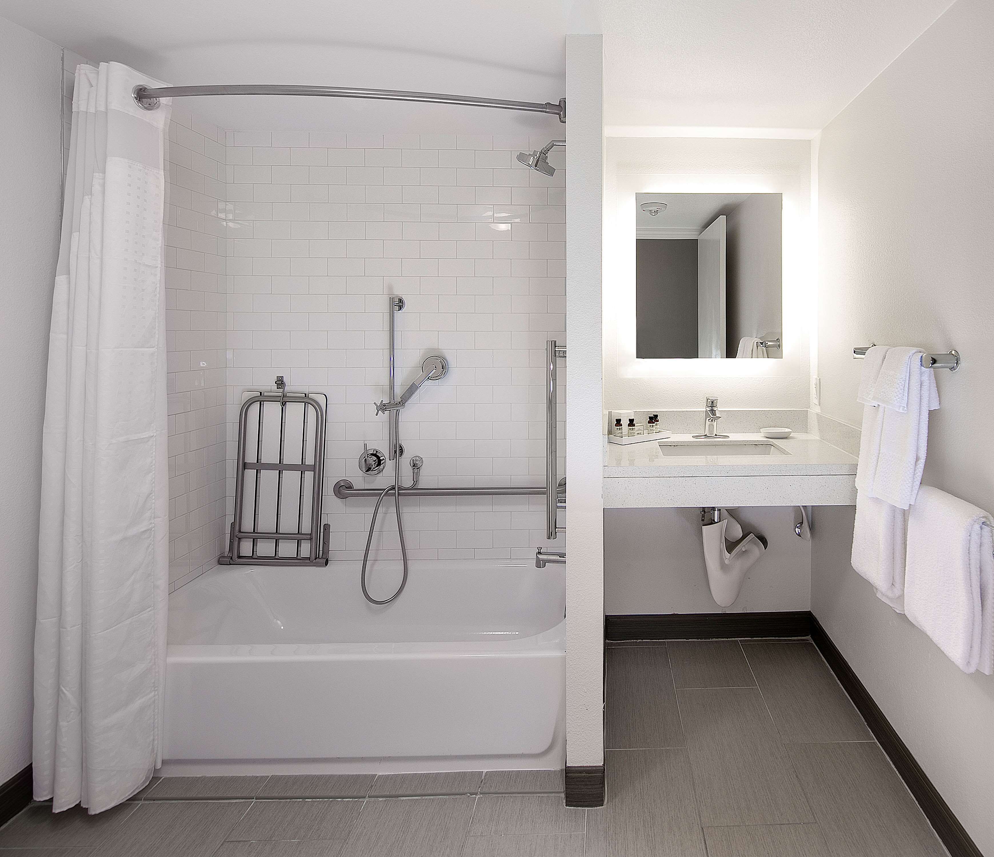 room, 1 queen bed, accessible, bathtub (hearing) | bathroom | combined shower/bathtub, designer toiletries, hair dryer, towels