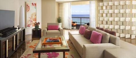 A modern living room with a sofa, coffee table, TV, and a balcony with a view.