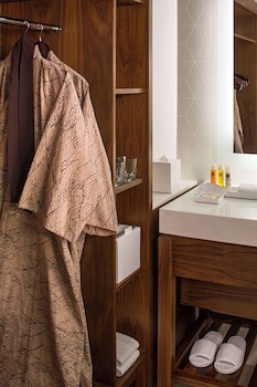 Combined shower/tub, designer toiletries, hair dryer, slippers at Hyatt Regency Waikiki Beach Resort & Spa