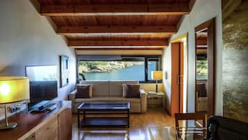 Superior Suite, 1 King Bed, Hot Tub, Sea View | Minibar, in-room safe, individually decorated, desk