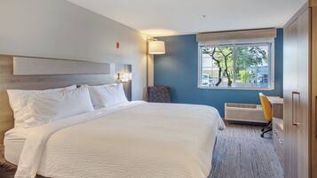 Luxe beddengoed, pillowtop-bedden, een kluis op de kamer, een bureau