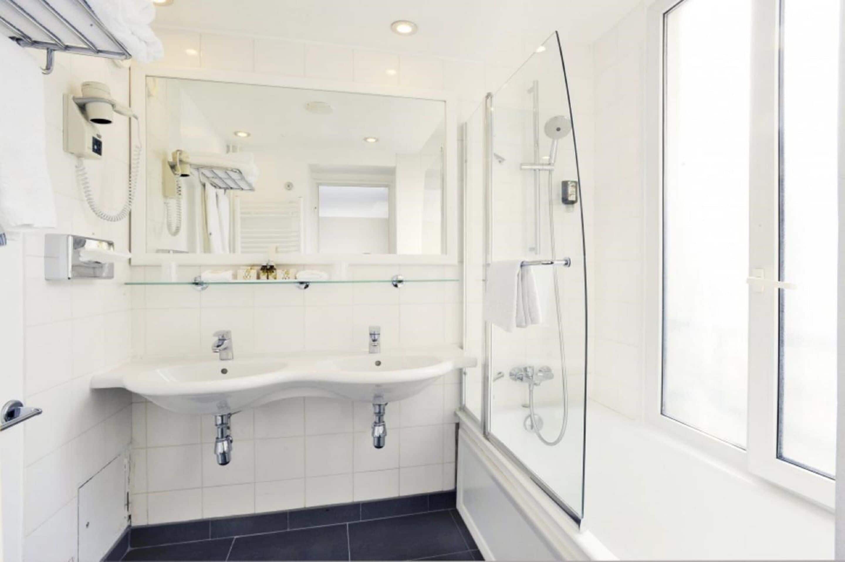 combined shower/bathtub, deep-soaking bathtub, hair dryer, towels