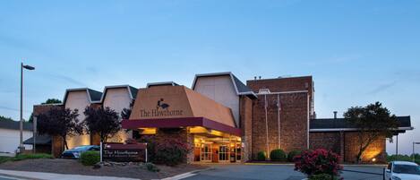 The Hawthorne Inn & Conference Center with a brick facade, a prominent entrance, and a landscaped front area.