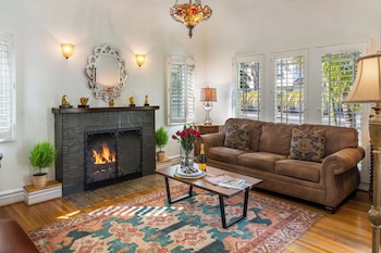 Santa barbara casita | Living area | 32-inch flat-screen TV with cable channels, TV at The Eagle Inn