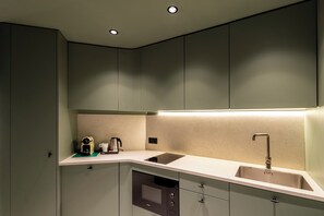 Suíte superior, cozinha americana | Roupas de cama premium
