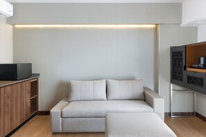 Junior Suite, 1 King Bed with Sofa bed, City View | Living area | 43-inch flat-screen TV with satellite channels, TV