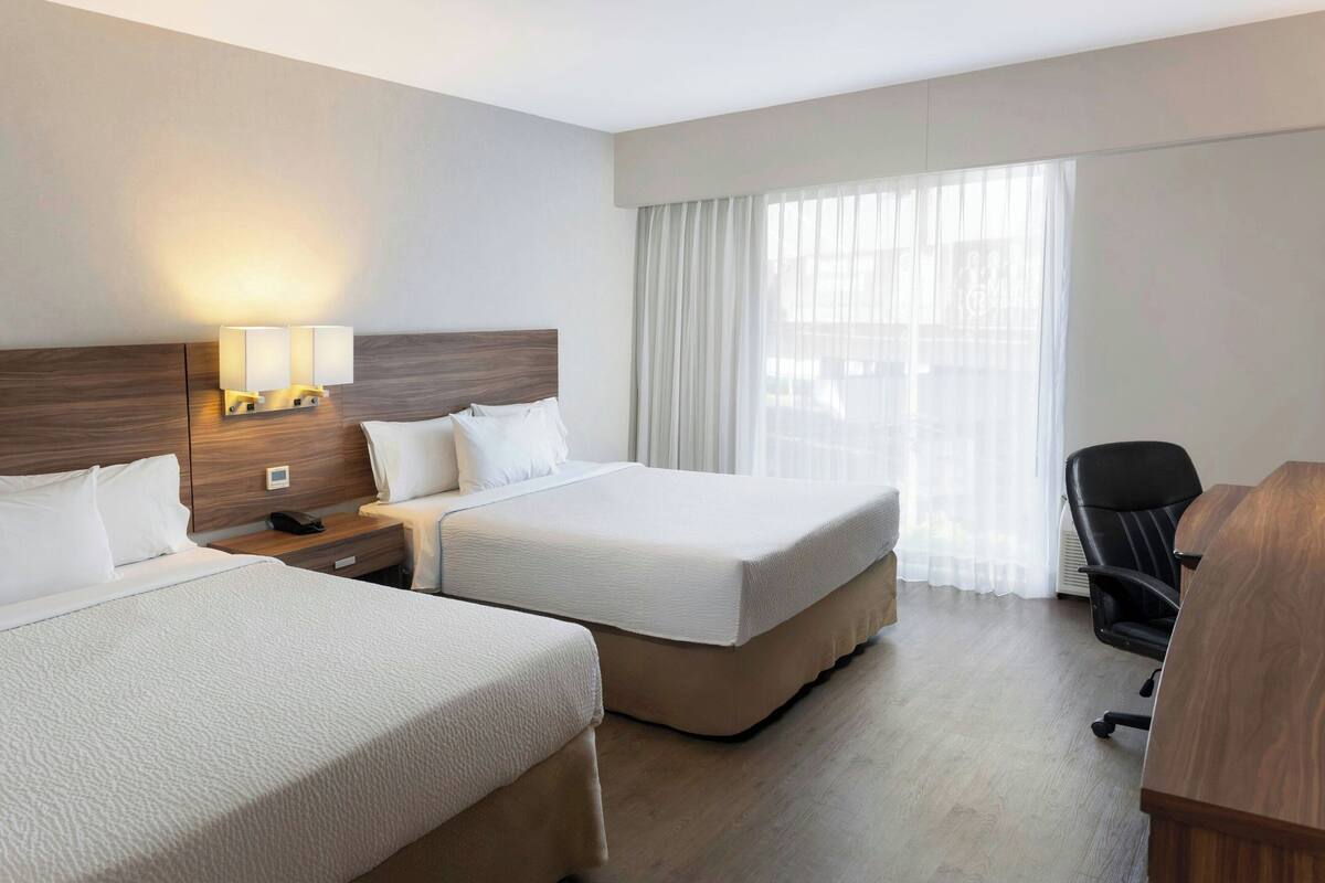 Classic Room, 2 Double Beds, Smoking, City View | Minibar, in-room safe, desk, laptop workspace