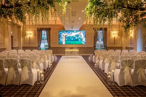 Intimate wedding ceremonies take place in this elegant space, surrounded by lush greenery and beautiful floral arrangements.