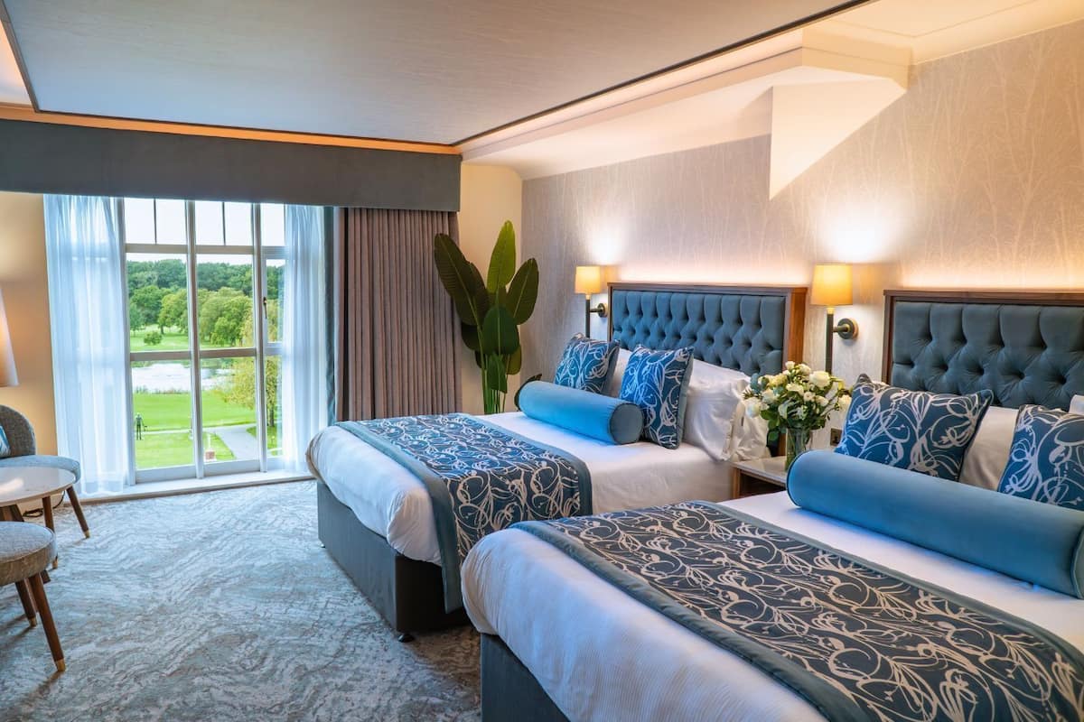 estate view twin guest room | premium bedding, in-room safe, desk, blackout curtains