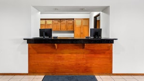 A kitchen with a wooden countertop and cabinets.
