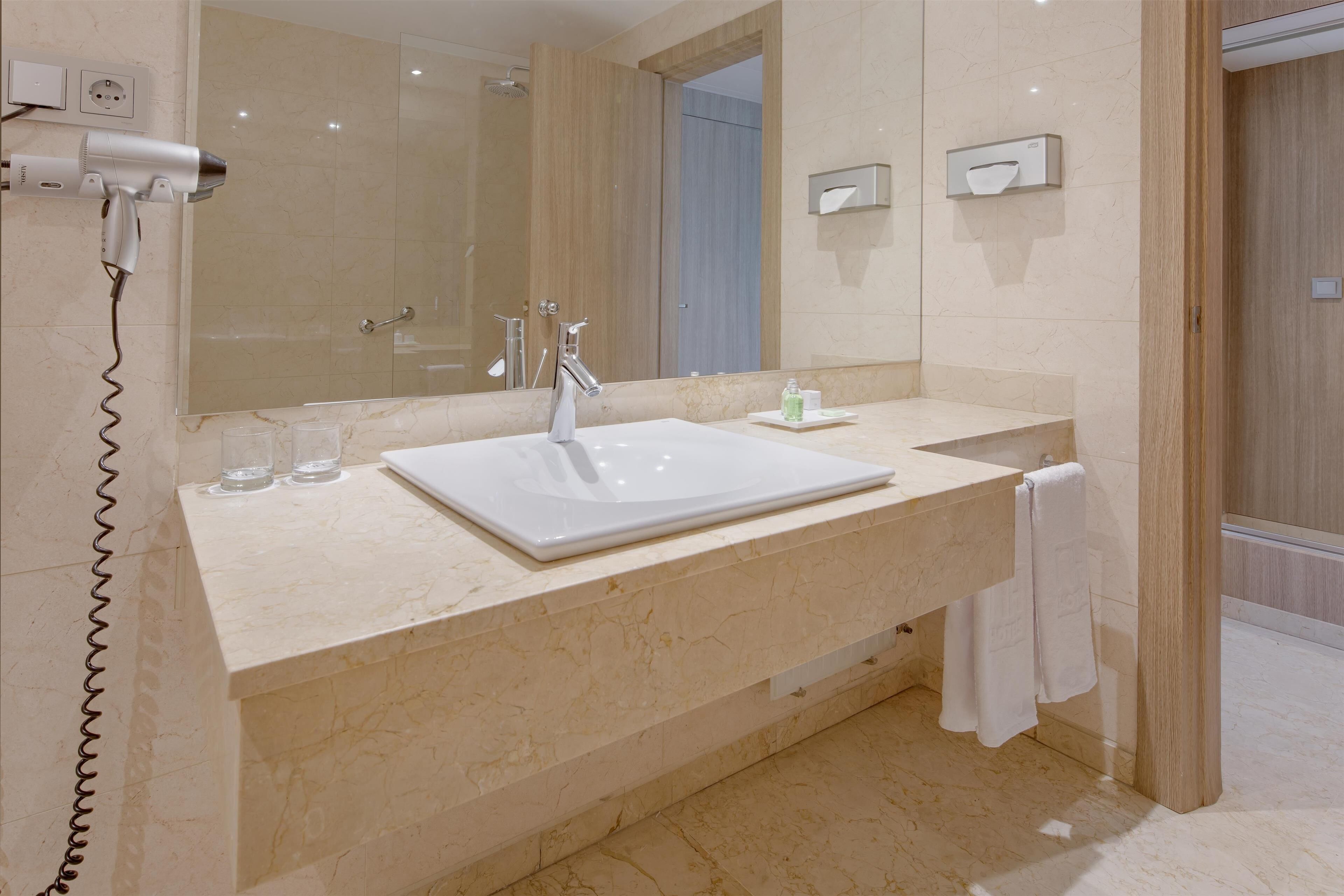 shower, eco-friendly toiletries, hair dryer, towels