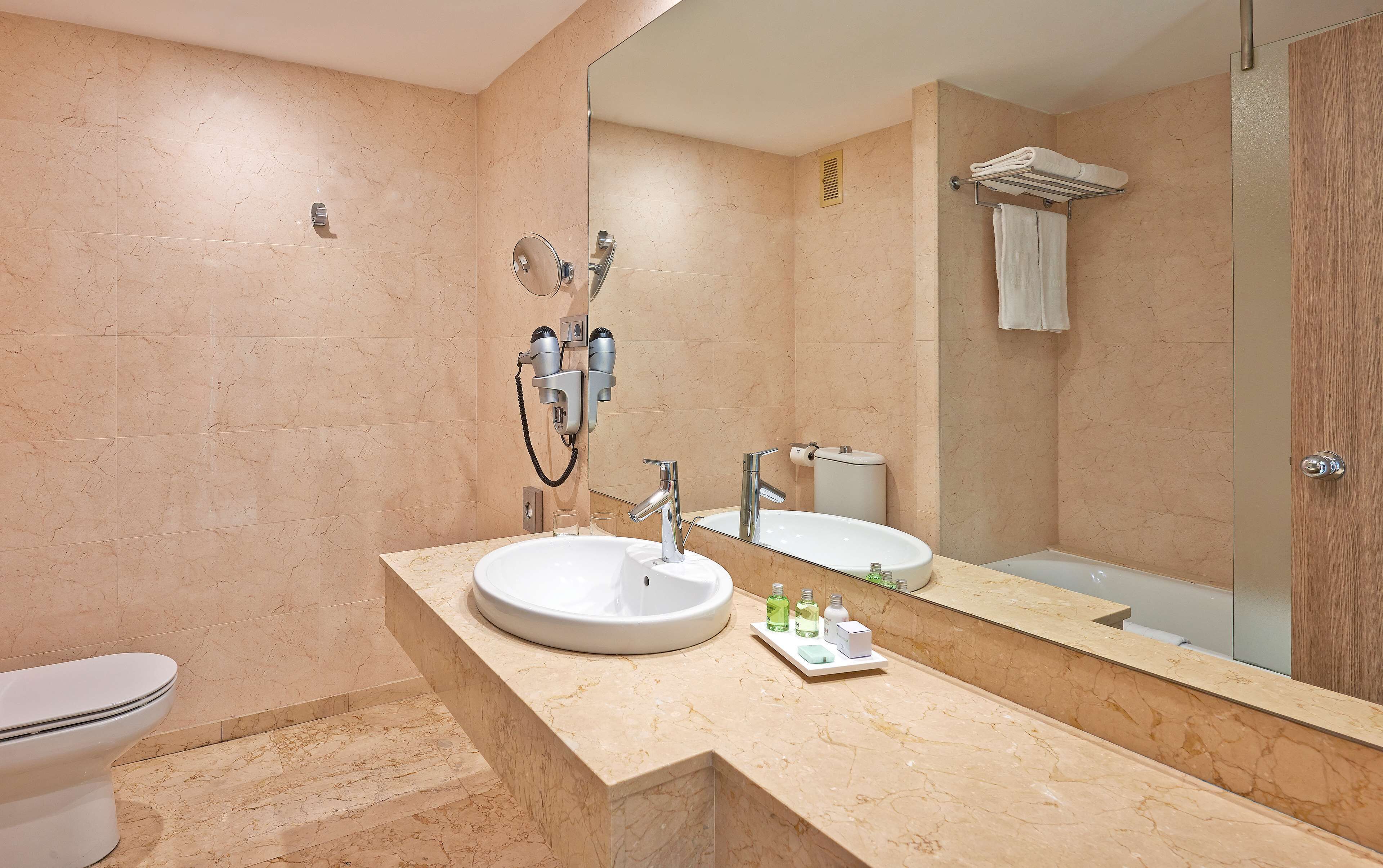 shower, eco-friendly toiletries, hair dryer, towels
