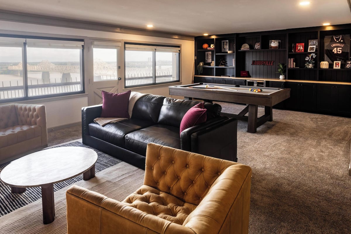 Suite, Multiple Beds (UofL Basketball) | Living area | Flat-screen TV