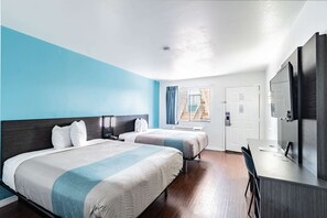 Escritorio, cortinas opacas, wifi gratis y ropa de cama