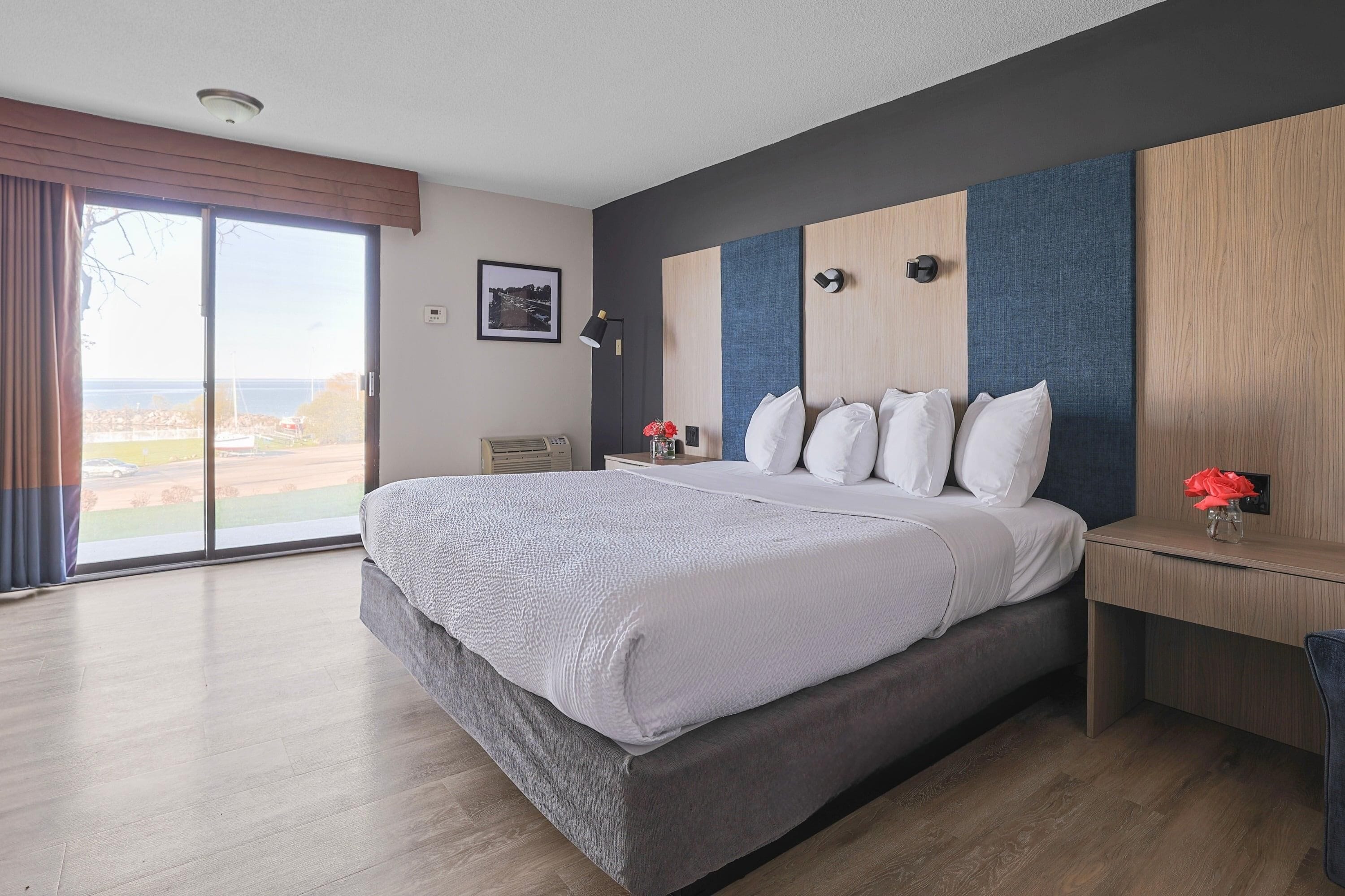 Desk, laptop workspace, blackout drapes, iron/ironing board