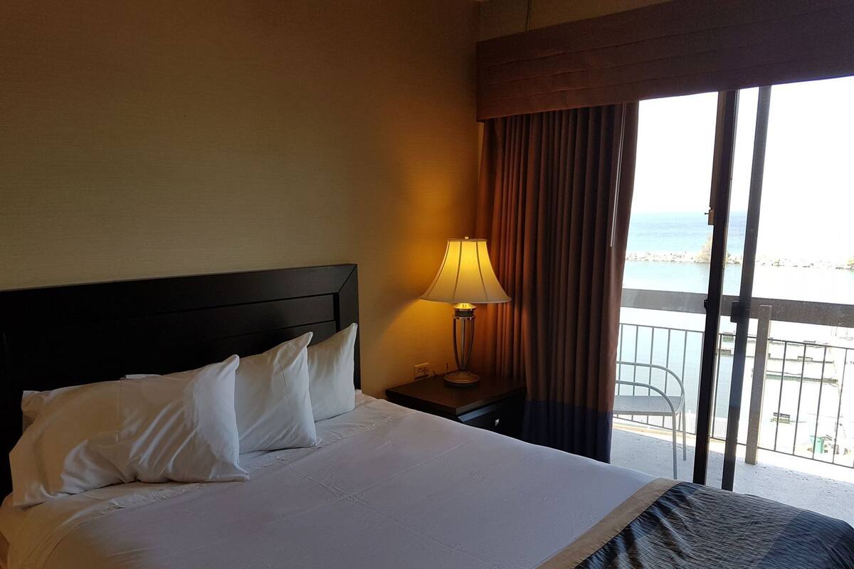 Desk, laptop workspace, blackout curtains, iron/ironing board