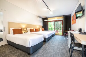 Studio Family | Desk, blackout drapes, iron/ironing board, bed sheets