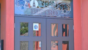 A double door with a sign above it that reads "BISTRO". - Peppermill Inn (Kialla)