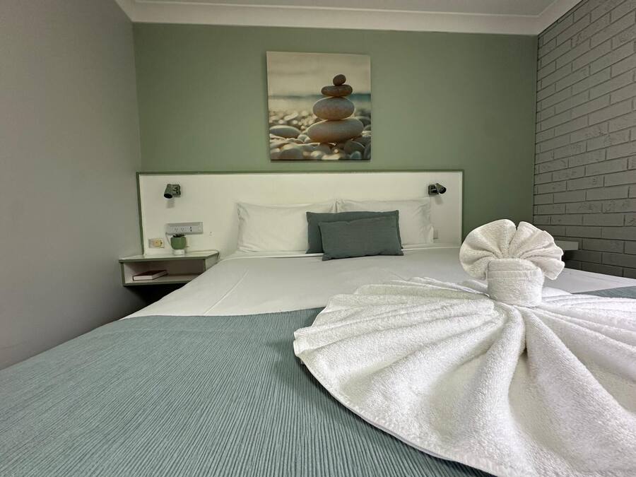 Premium bedding, pillow-top beds, desk, laptop workspace