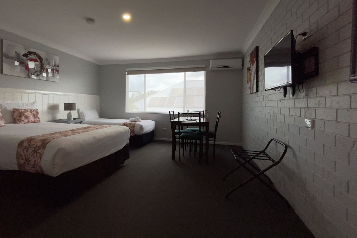 Premium bedding, pillow-top beds, desk, laptop workspace