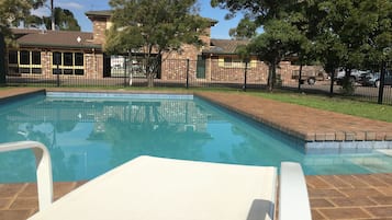 Seasonal outdoor pool, pool loungers