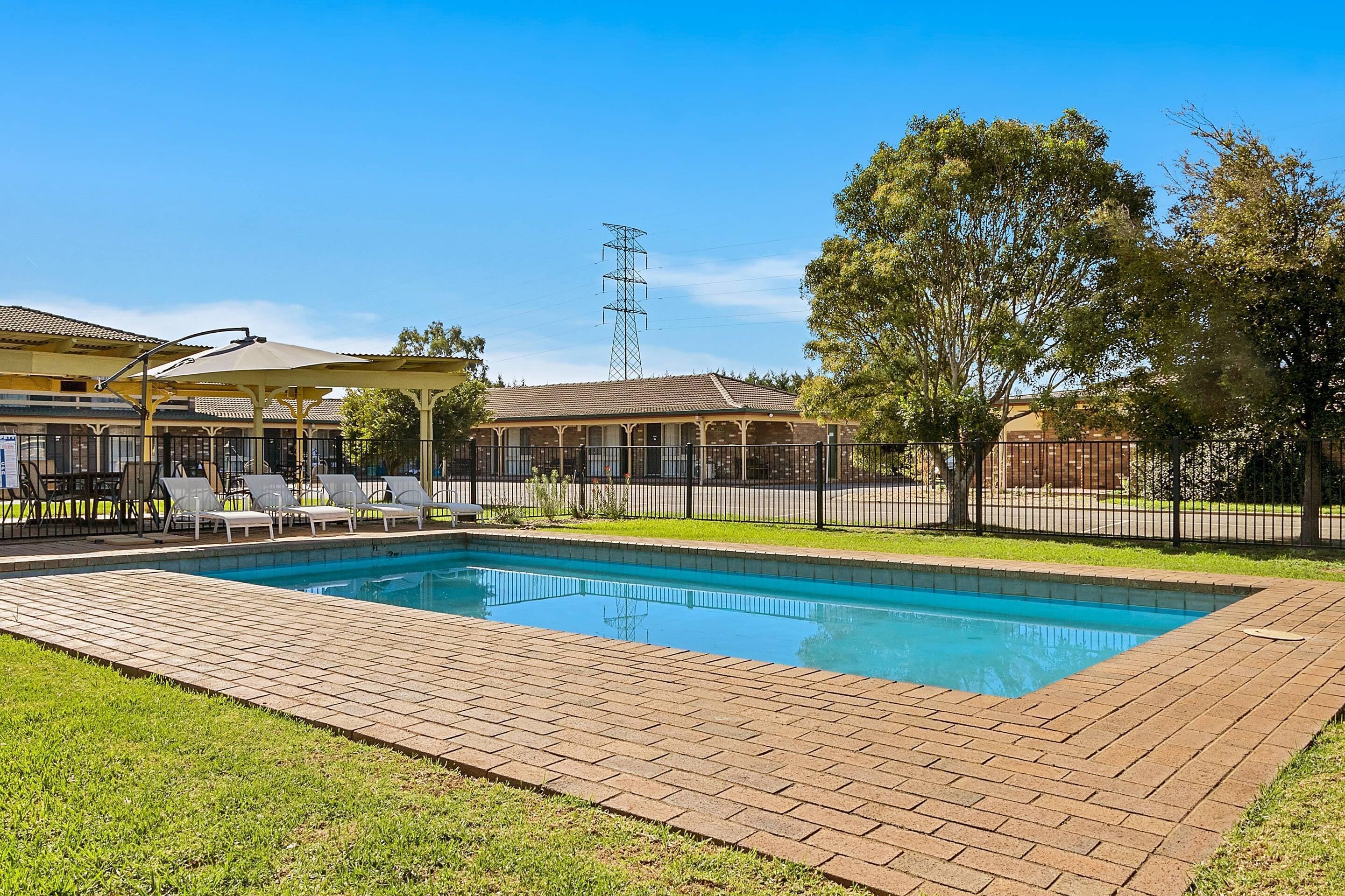 Seasonal outdoor pool, pool loungers