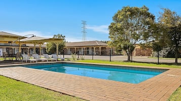 Seasonal outdoor pool, pool loungers