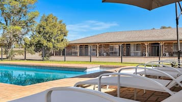 Seasonal outdoor pool, pool loungers