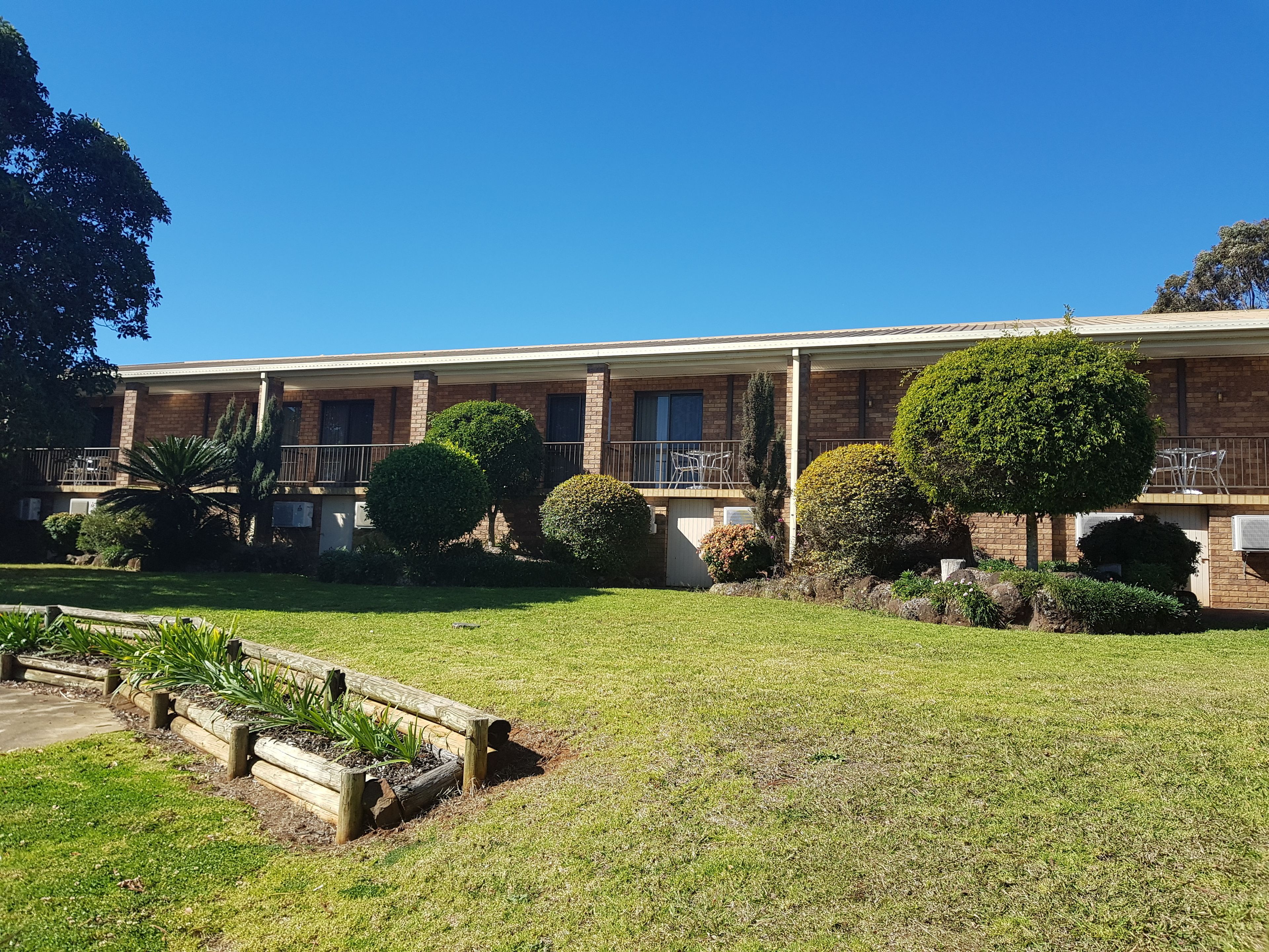 standard queen room, garden view with balcony” | terrace/patio
