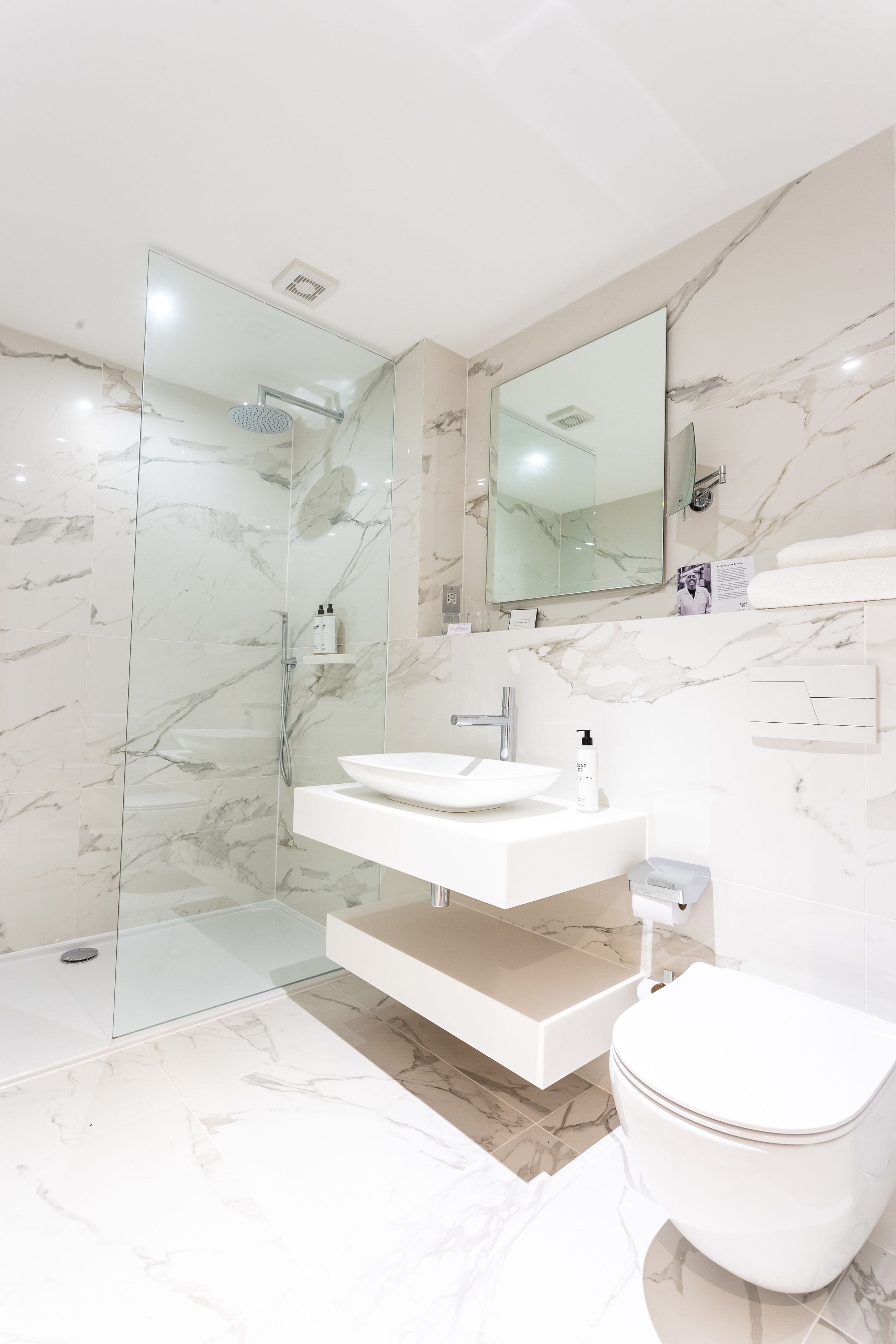 combined shower/bathtub, deep-soaking bathtub, rainfall showerhead