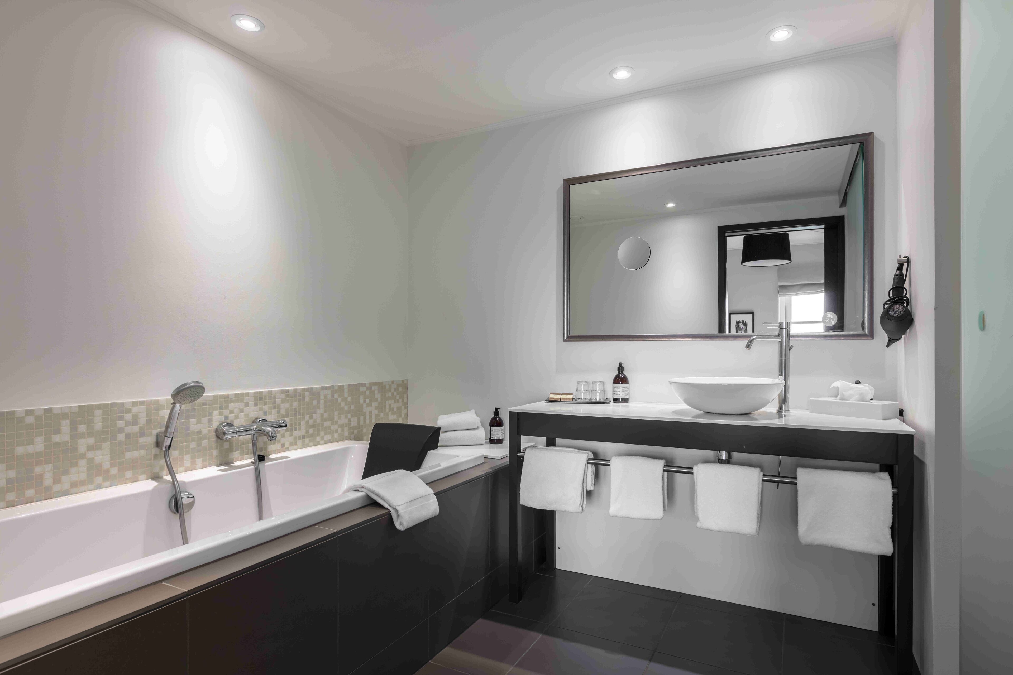 suite, 1 king bed with sofa bed, non smoking | bathroom | shower, eco-friendly toiletries, hair dryer, towels