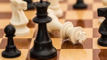 A chessboard with pieces in various positions.