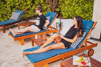 Outdoor pool, sun loungers at San Juan Hotel