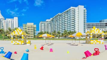 On the beach, sun-loungers, beach umbrellas, beach towels