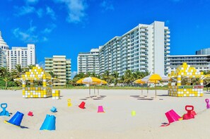 On the beach, sun-loungers, beach umbrellas, beach towels