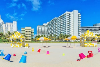 On the beach, sun loungers, beach umbrellas, beach towels at San Juan Hotel