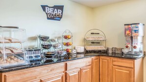 A breakfast buffet area with various food items and a sign that reads "BEAR ROUTES". - Days Inn by Wyndham Middletown/Newport Area (Middletown)