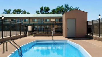Seasonal outdoor pool, open 10:00 AM to 10:00 PM, pool loungers