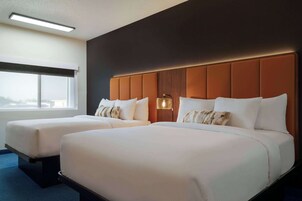 Premium bedding, pillowtop beds, desk, laptop workspace