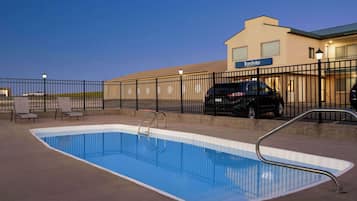 Seasonal outdoor pool, open 10:00 AM to 10:00 PM, pool loungers