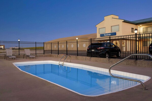 Seasonal outdoor pool, open 10:00 AM to 10:00 PM, sun loungers