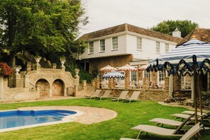 Seasonal outdoor pool, pool umbrellas, pool loungers