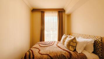 Down duvets, desk, blackout curtains, iron/ironing board