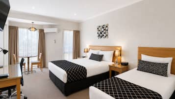 Standard Room, Multiple Beds, Non Smoking | Pillowtop beds, free minibar, desk, laptop workspace