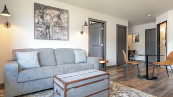 Deluxe Suite, 1 King Bed with Sofa bed, Kitchenette, Mountain View | Living area | 50-inch Smart TV with cable channels, TV