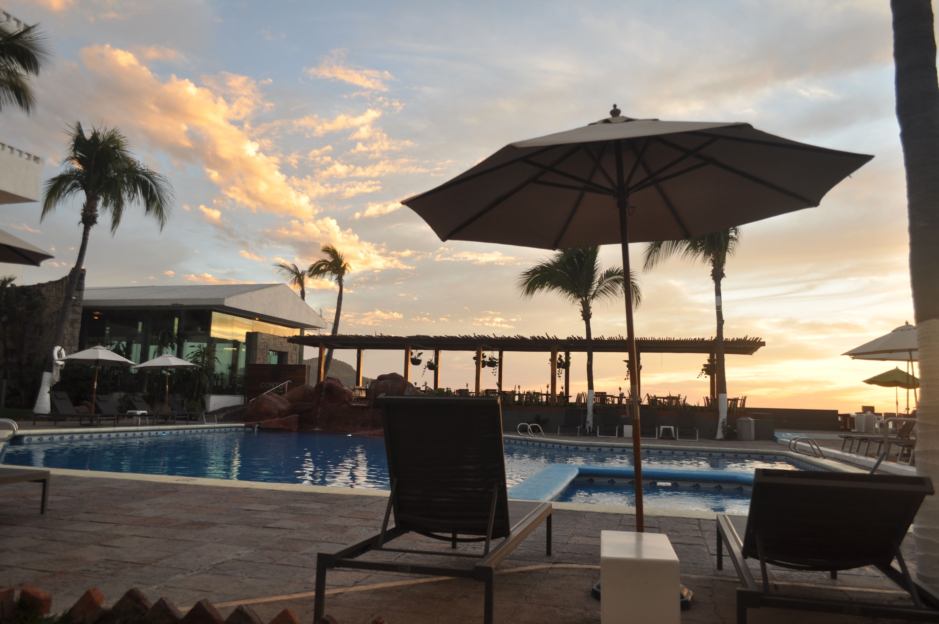 Outdoor pool, pool umbrellas, pool loungers