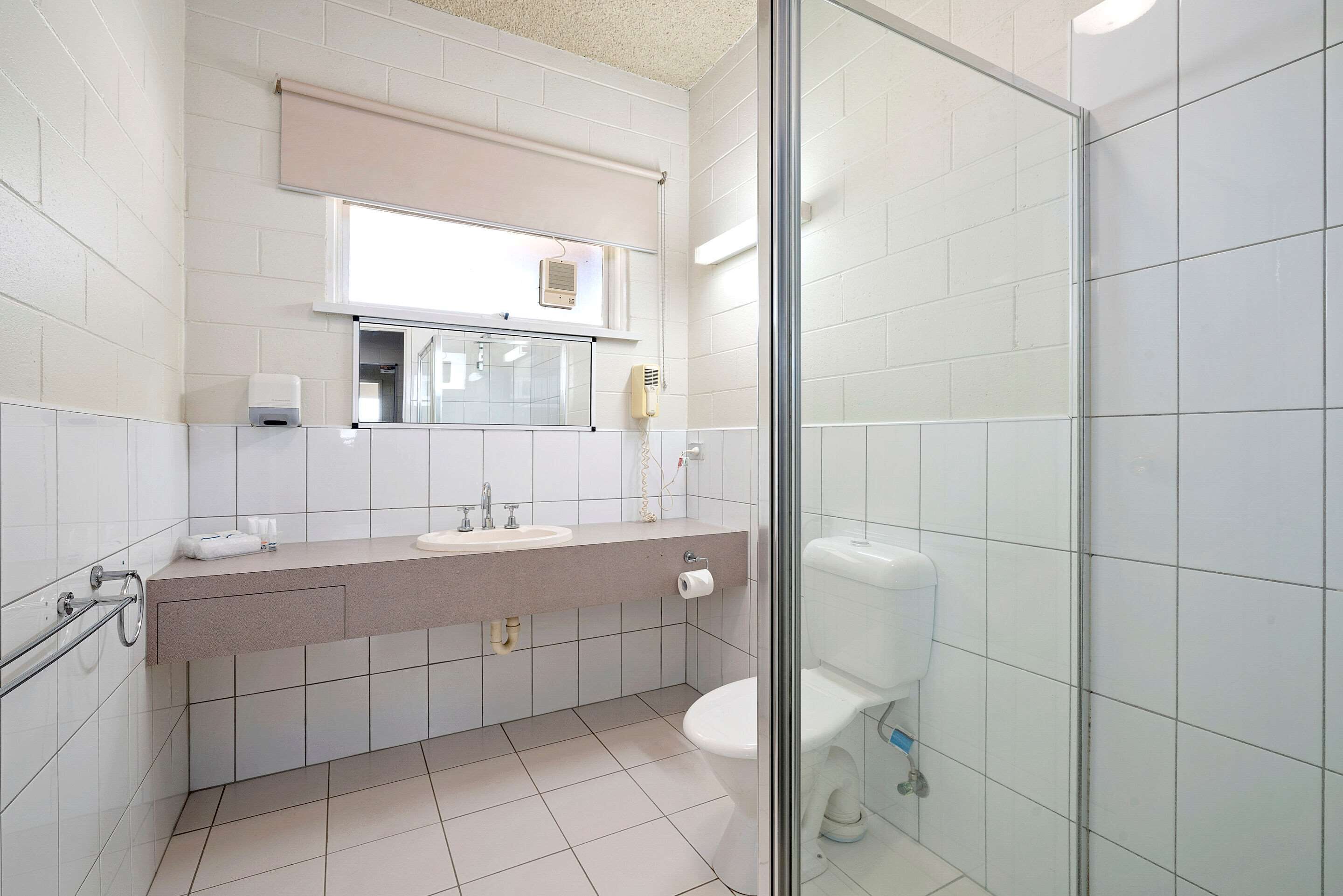 standard suite (1 queen bed & 1 twin bed) | bathroom | hair dryer, towels