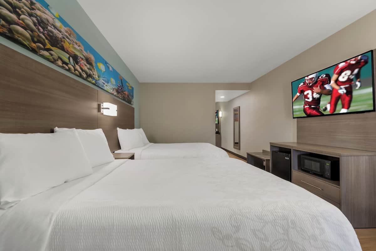 Suite, 2 Double Beds (Smoke Free) | Desk, laptop workspace, blackout drapes, iron/ironing board